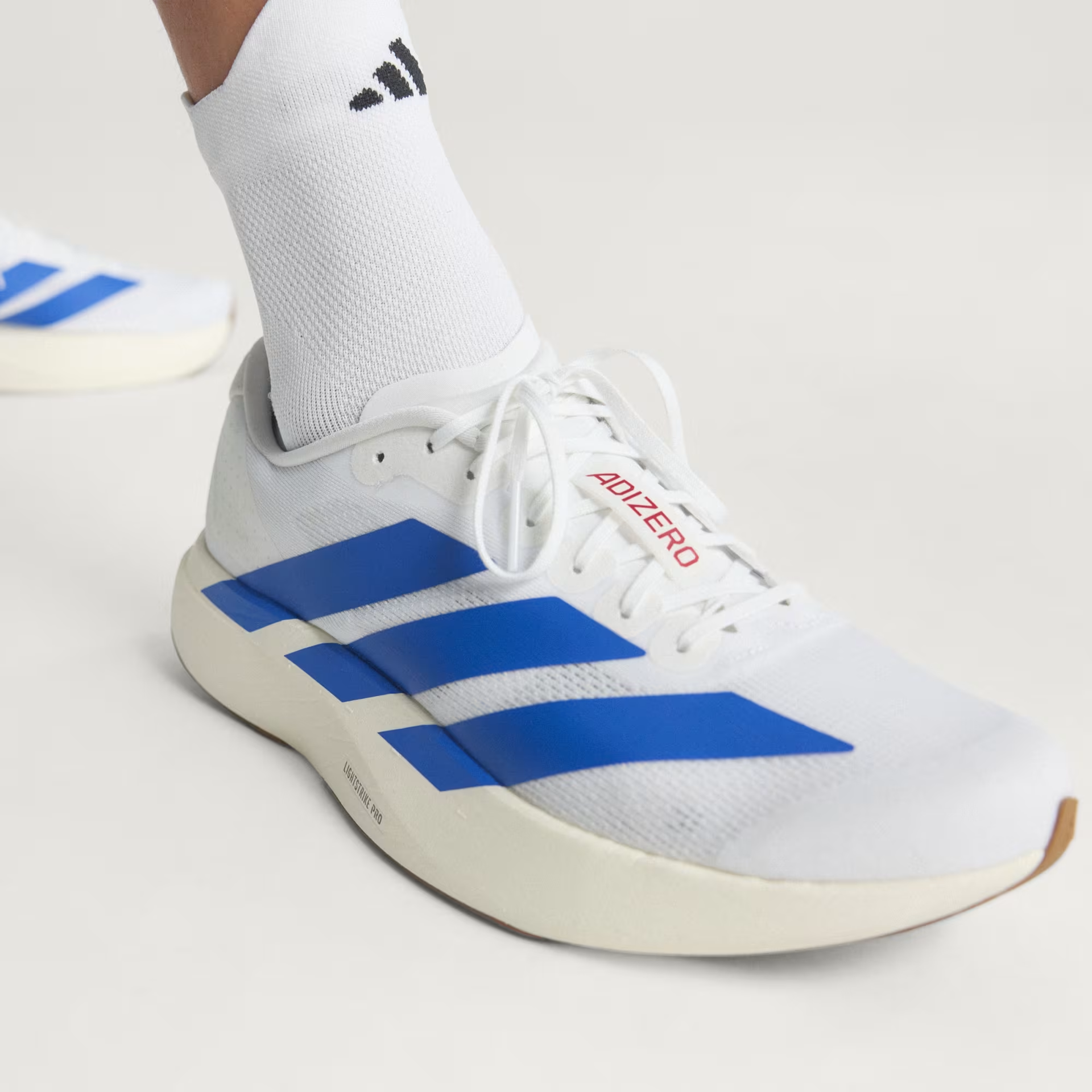 Adidas Men's Adizero Evo SL Shoes in Cloud White/Royal Blue/Pure Ruby