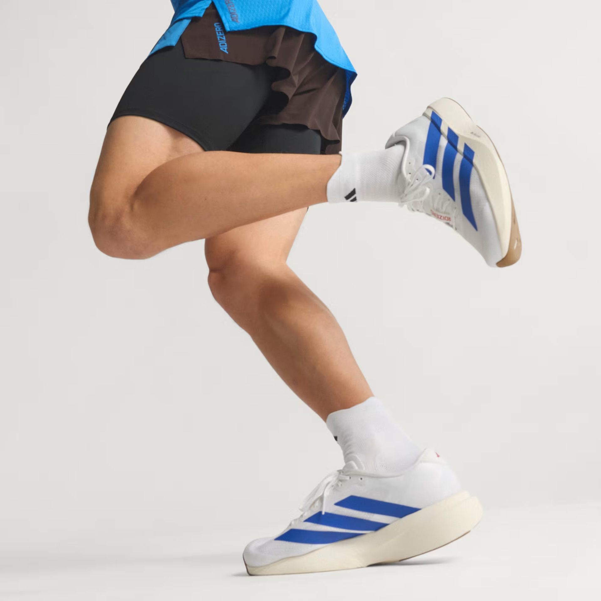 Adidas Men's Adizero Evo SL Shoes in Cloud White/Royal Blue/Pure Ruby